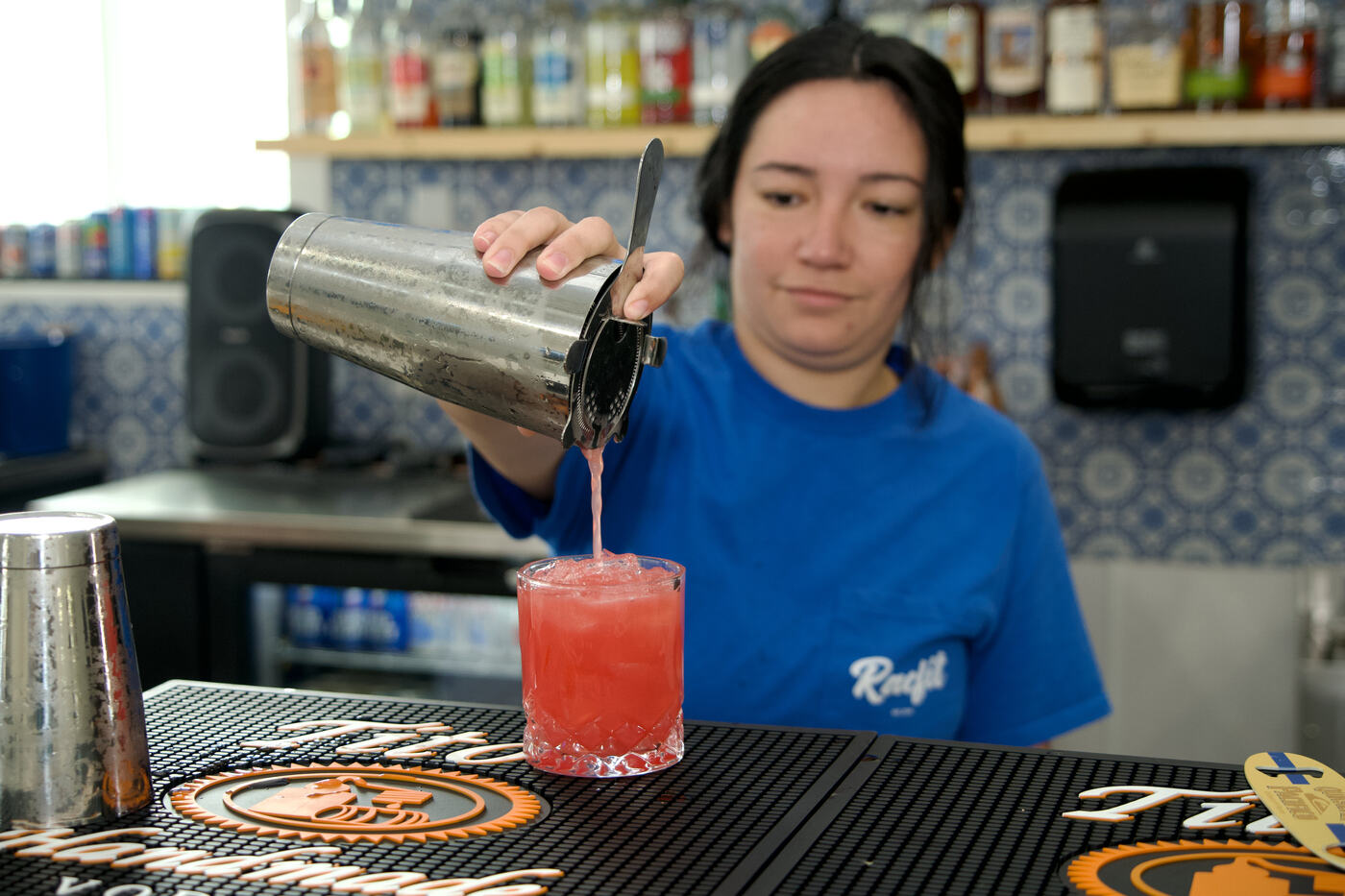 Bartender pouring a drink at Courtside Cantina in Buda, Texas