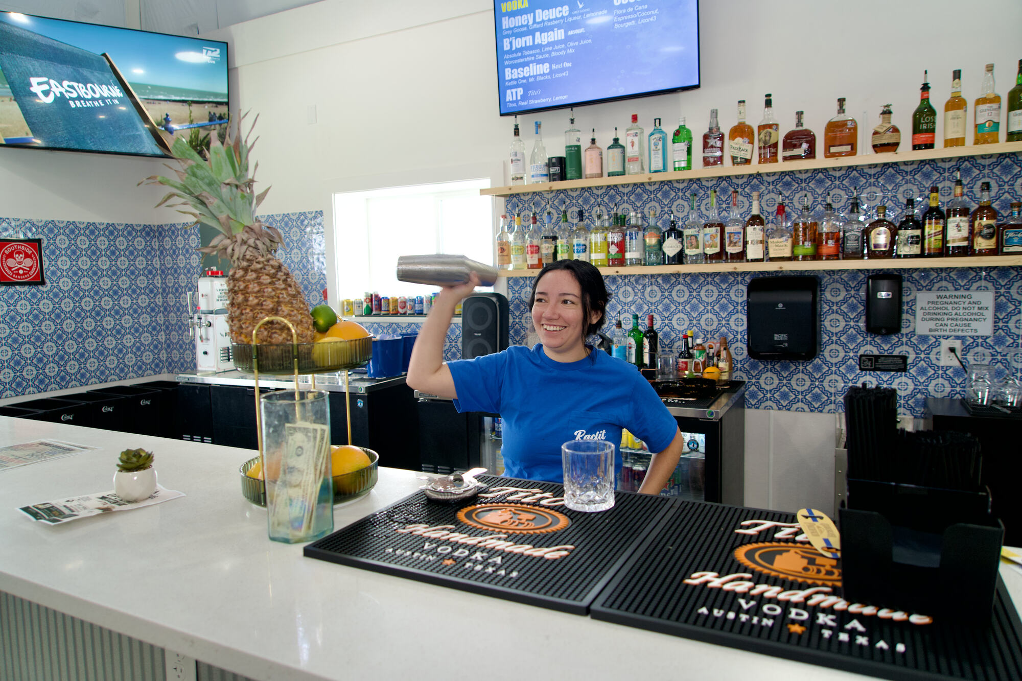 Bartender shaking a cocktail at Courtside Cantina in Buda, Texas