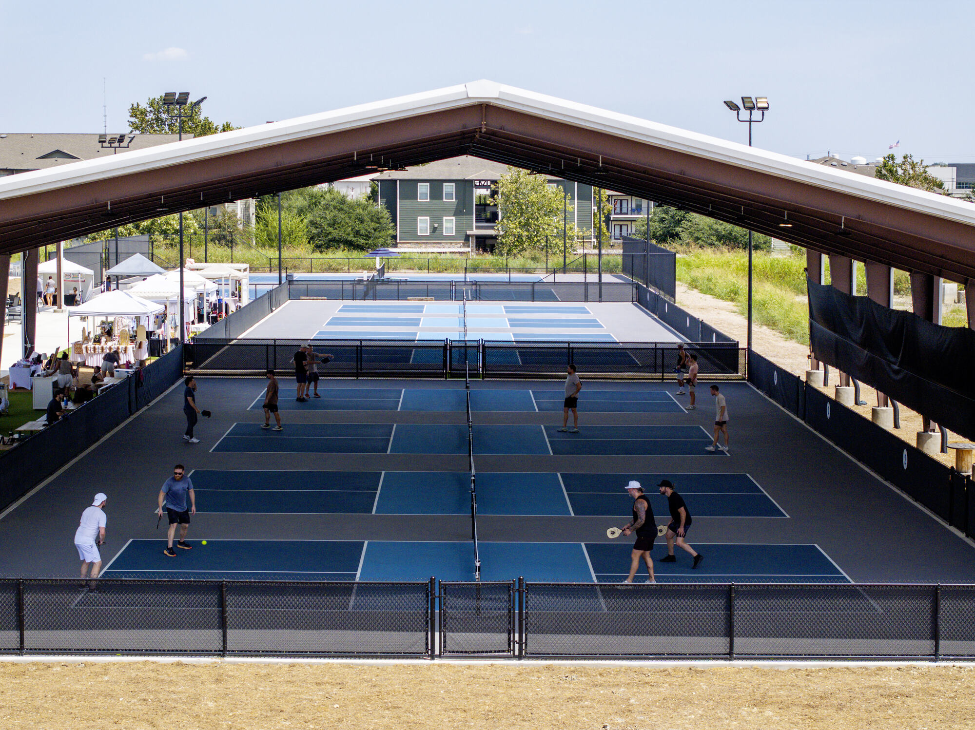 Aerial view of the covered pickleball courts at RacFit in Buda, Texas