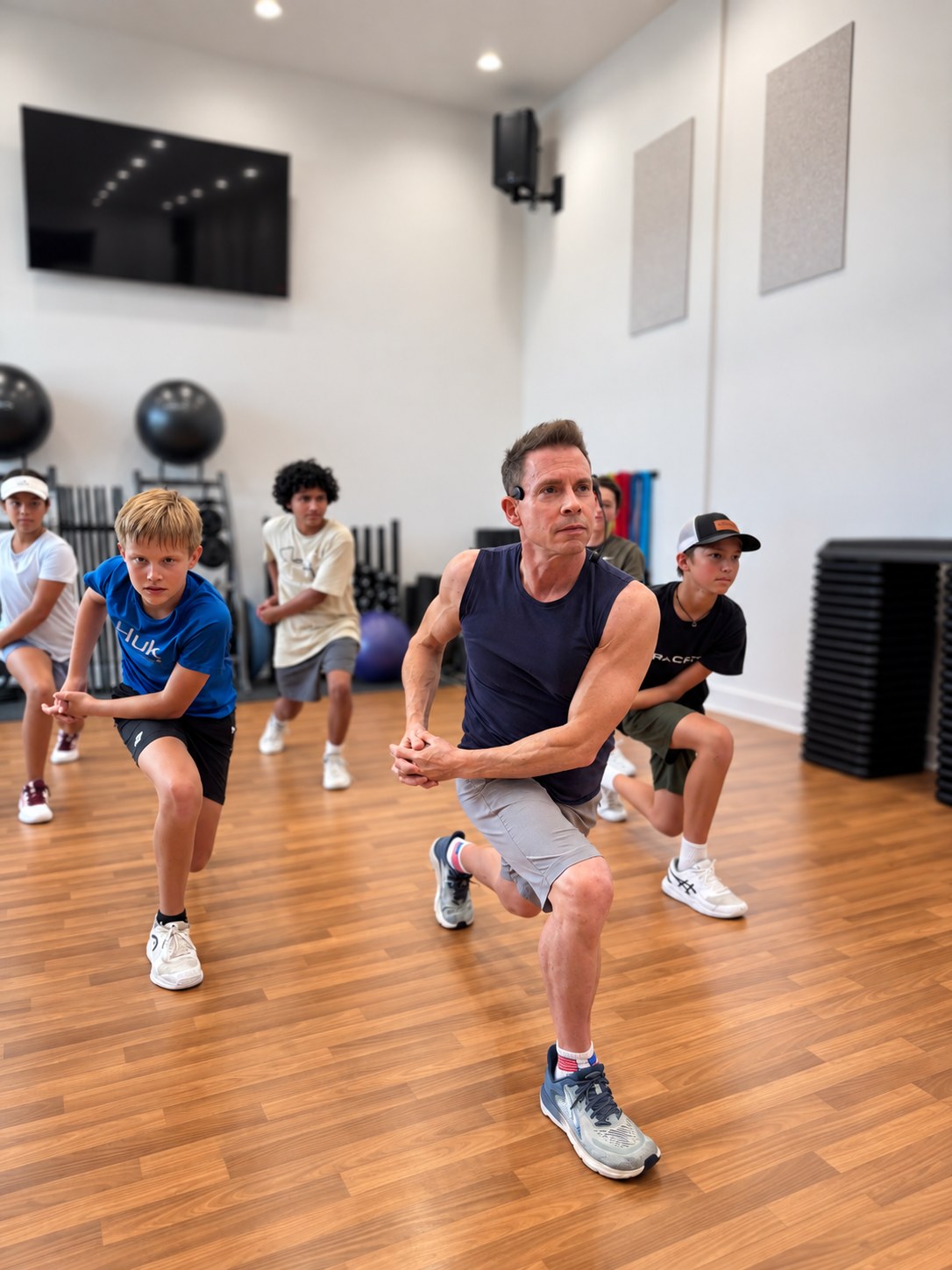 High Performance juniors working through a lunge in a conditioning session at RacFit in Buda, Texas