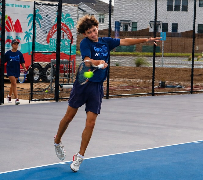 High Performance junior jumping into a forehand at RacFit in Buda, Texas