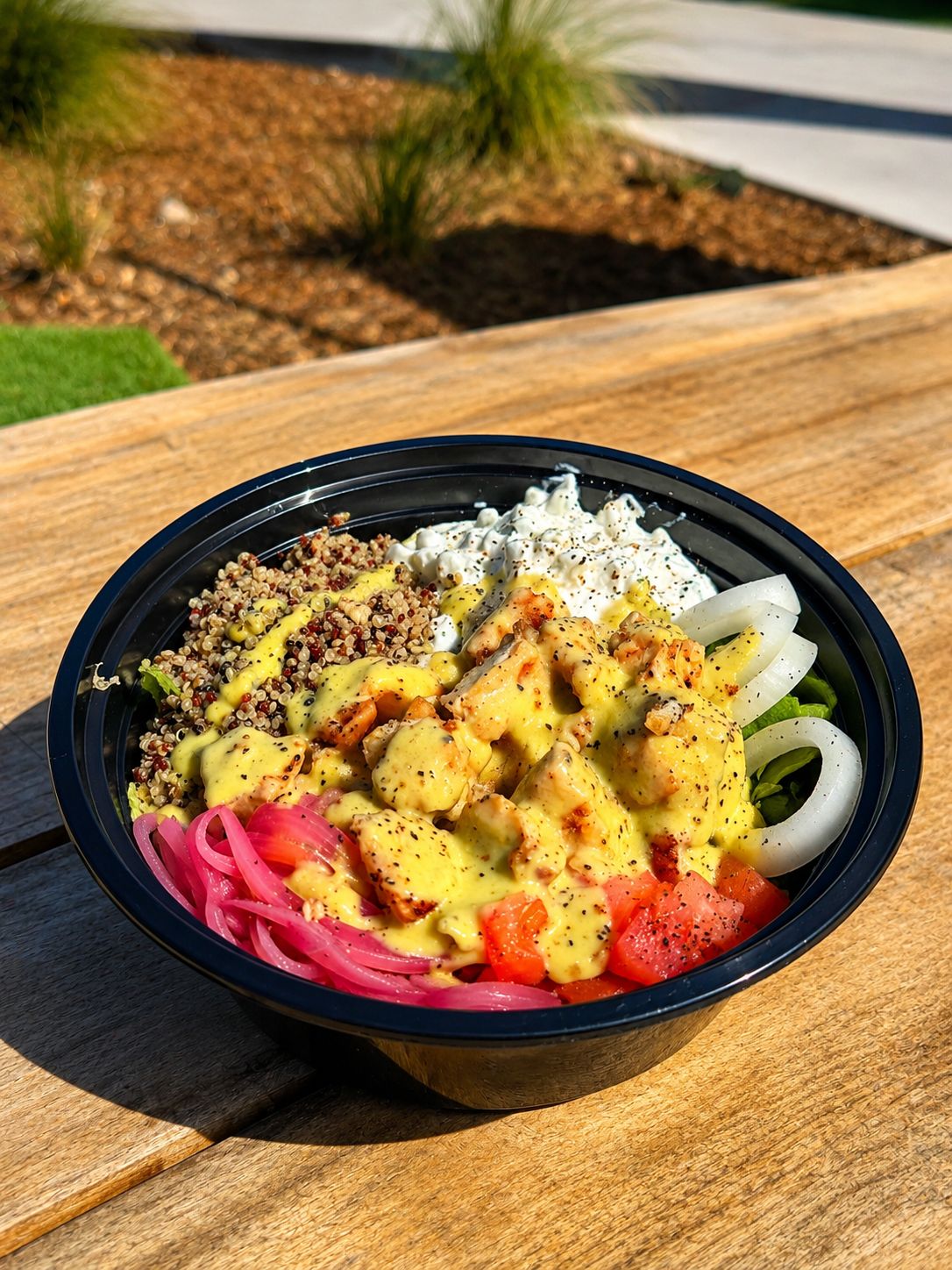 Grilled chicken and quinoa bowl with pickled onions from Yachties at RacFit in Buda, Texas