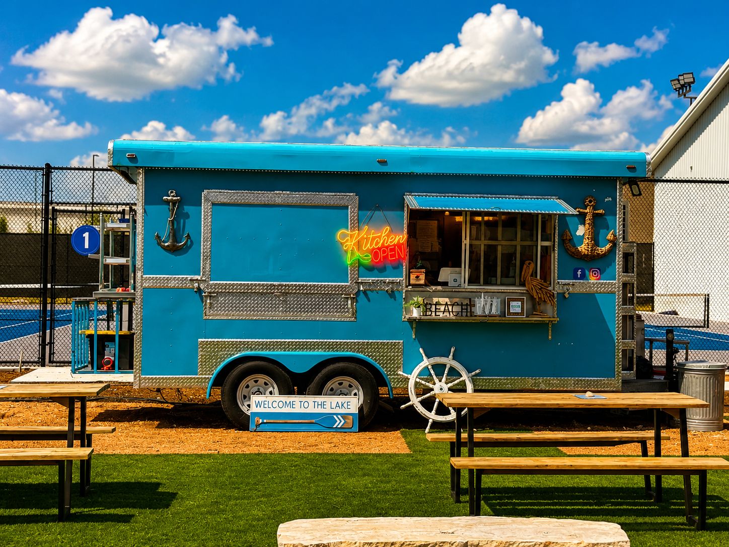 The Yachties food truck beside the picnic tables and courts at RacFit in Buda, Texas
