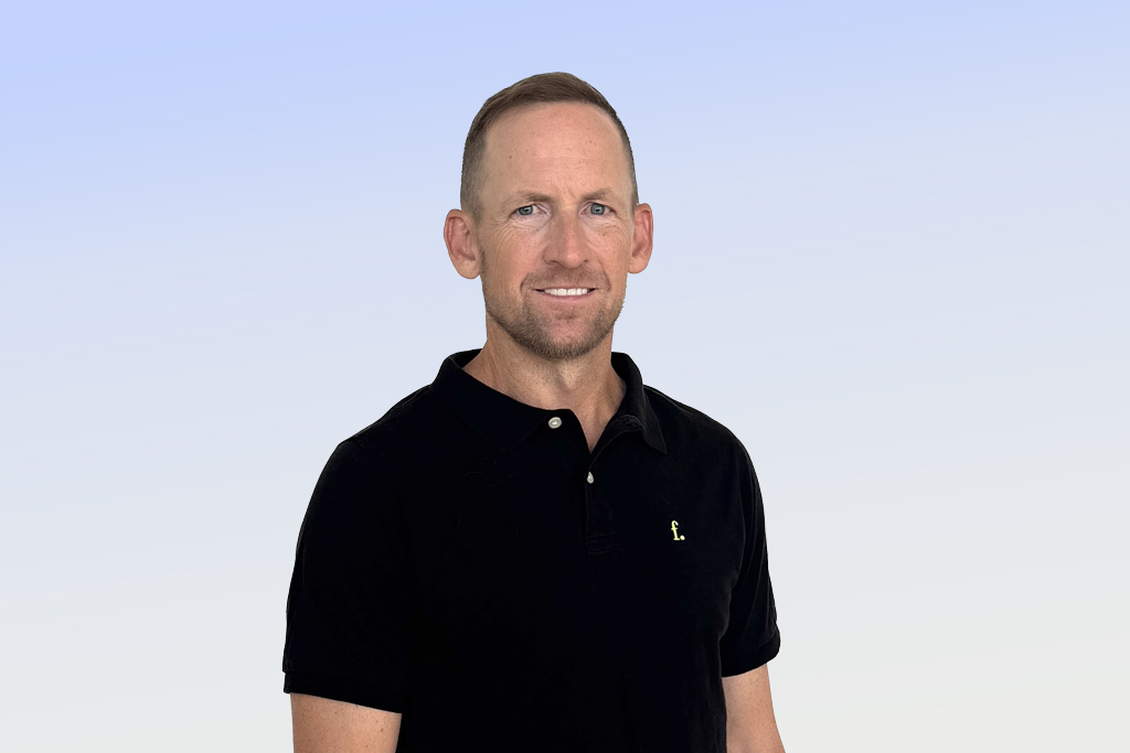 Man in casual black shirt, smiling