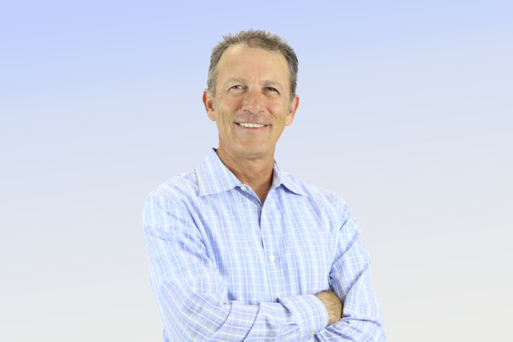 Smiling man in blue plaid shirt